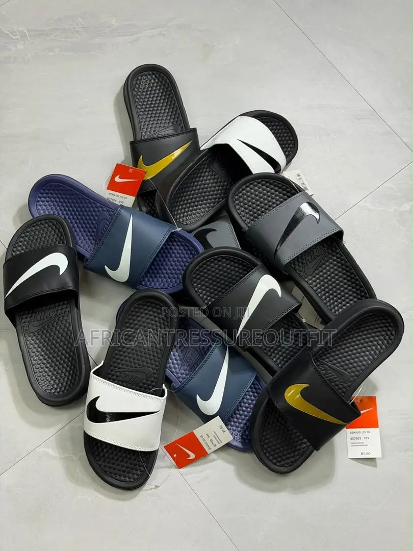 NIKE BENASSI SLIDES Feature a Textured Footbed