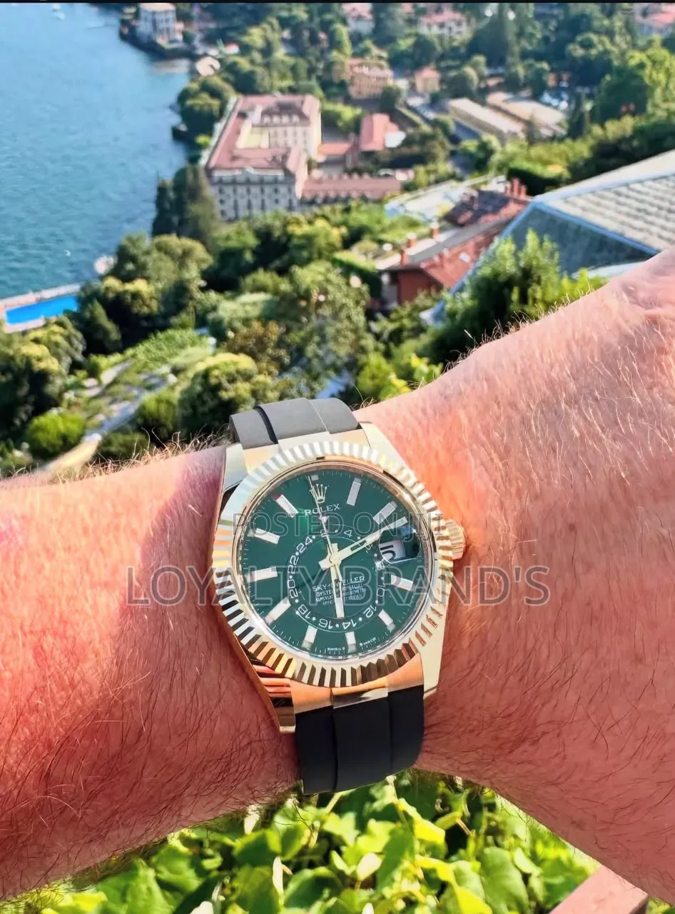 Rolex 
Sky-Dweller 
Yellow Gold on Oysterflex
Green Dial