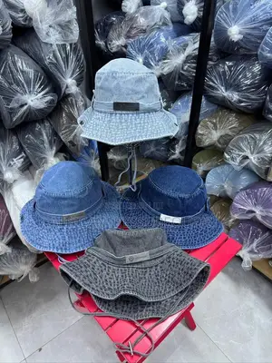 Loewe Denim Buckets Hats Feature a Prominent White Logo Patch on Front