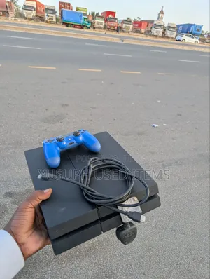 Ps4 Slim/Ina Game/Fifa 2026/Anchatad/Last of Us/Mireka/Ina Pad Mbili/