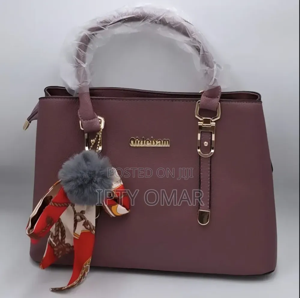 Purple Handbag With a Stylish Scarf Pom-Pom Chain