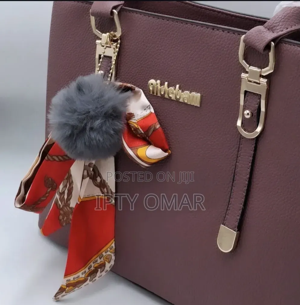 Purple Handbag With a Stylish Scarf Pom-Pom Chain